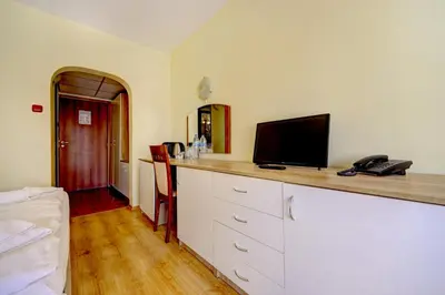 a room with a counter with a television on it at Hotel Borovets Palace in Borovets
