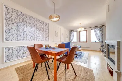 a dining room with a table and chairs at Ski Slope Getaway at Grand Monastery in Pamporovo