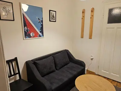 a living room with a couch and a table at Super Central 2BR FREE Parking in Sofia