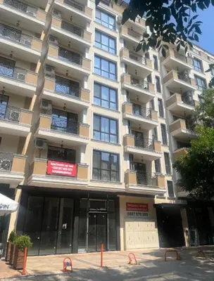 a large apartment building with a sign on it at Guest House Amaya Med 2 in Plovdiv