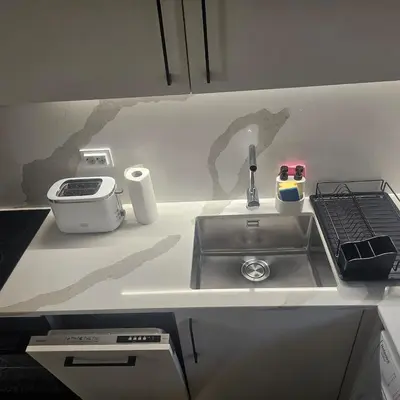 a kitchen counter top with a sink and a counter top at Luxury Suite Old Plovdiv with parking in Plovdiv