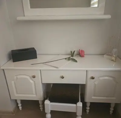 a white desk with a pink rose on top of it at Luxury Suite Old Plovdiv with parking in Plovdiv