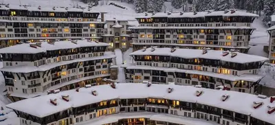 a group of apartment buildings covered in snow at Гранд Манастира 4А30 Весела Ваканция in Pamporovo