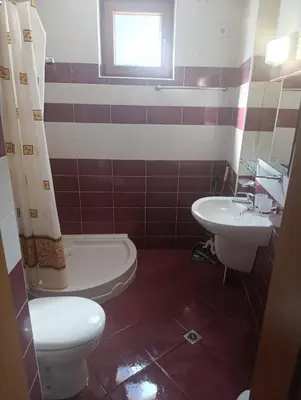a bathroom with a toilet and a sink at Гранд Манастира 4А30 Весела Ваканция in Pamporovo