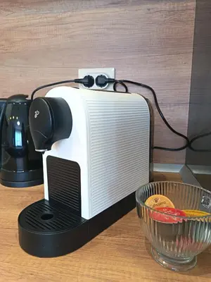 a toaster sitting on top of a counter next to a bowl at Boutique apartment family 5 in Plovdiv
