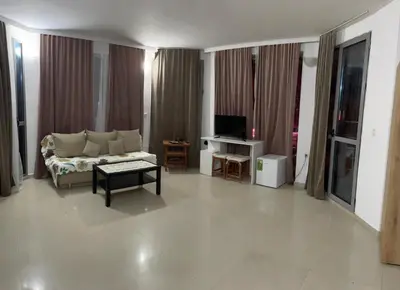 a living room with a couch and a tv at Casa De Zambini in Plovdiv