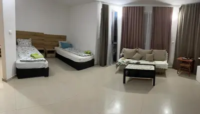 a living room with two beds and a couch at Casa De Zambini in Plovdiv