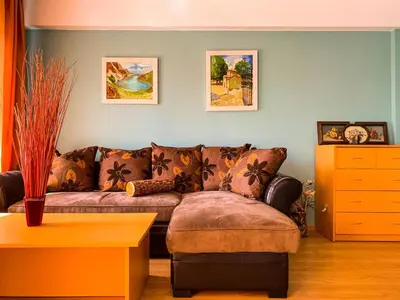 a living room with a couch and a table at Villa Madera - Spacious House with Swimming Pool, Sauna and Pool Table in Saparewo