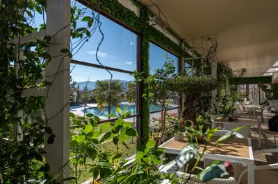 a room with a view of a pool through a window at Hotel Paradise in Ognyanovo
