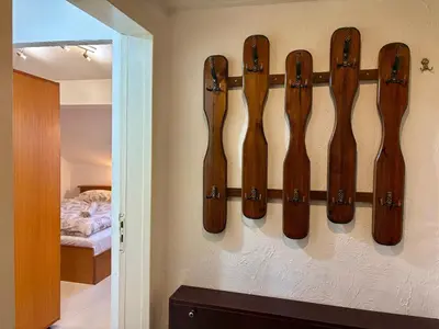 a bunch of wooden skis hanging on a wall at Prime Center - 1BDR Apt - Top Floor Next to the National Stadium & Sofia University in Sofia