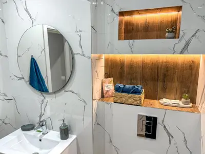 a bathroom with a sink and a mirror at 2BR Apartment in a Modern Complex with free Street Parking in Plovdiv