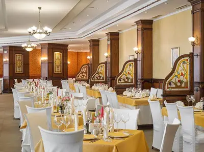 a banquet hall with white tables and white chairs at СПА апартамент 