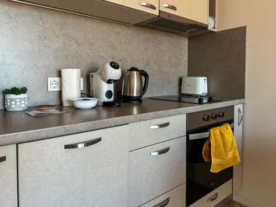 a kitchen with a counter top with a stove top oven at Quiet & Comfortable Urban Retreat in Sofia