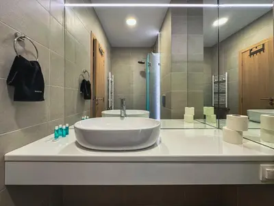 a bathroom with a sink and a mirror at Quiet & Comfortable Urban Retreat in Sofia