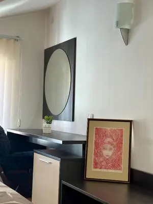 a room with a mirror and a desk with a picture at Alpine Apartment Home2Host in Bansko