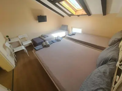 an overhead view of a room with two beds and a table at Let's Go Party - Plovdiv Center in Plovdiv