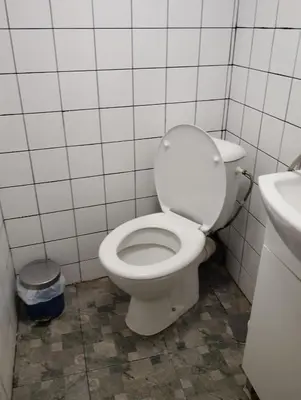a bathroom with a white toilet and a sink at Let's Go Party - Plovdiv Center in Plovdiv