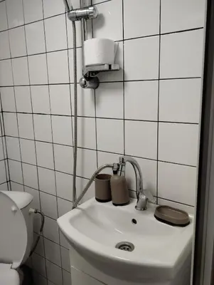 a bathroom with a sink and a toilet at Let's Go Party - Plovdiv Center in Plovdiv