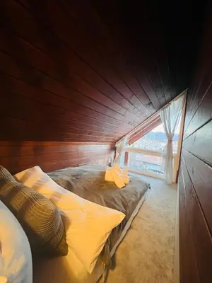 a small room with two beds in a boat at Cosy Dream Appartment near Borovets in Samokov