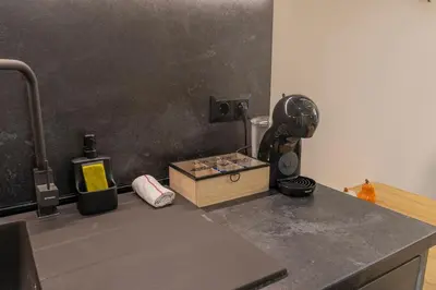 a kitchen counter with a mixer on a counter top at Luxury & Modern Apartment - Rowing Canal Plovdiv in Plovdiv