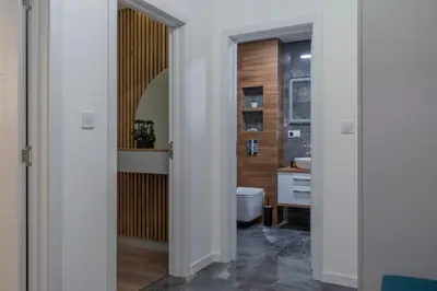 a bathroom with a toilet and a sink at Luxury & Modern Apartment - Rowing Canal Plovdiv in Plovdiv
