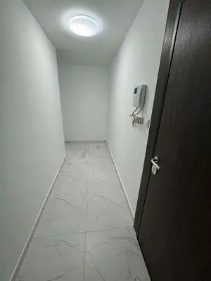a room with a hallway with a door and a television at Modern 1BR Apartment Plovdiv City Center Parking in Plovdiv
