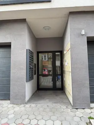 an entrance to a building with a revolving door at Modern 1BR Apartment Plovdiv City Center Parking in Plovdiv