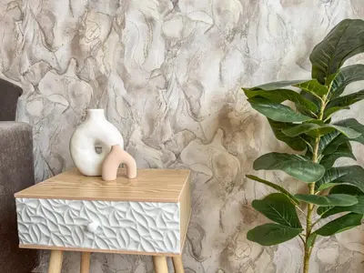 a white vase sitting on a table next to a plant at One-Bedroom Apartment next to Mall Plovdiv with Free Street Parking in Plovdiv
