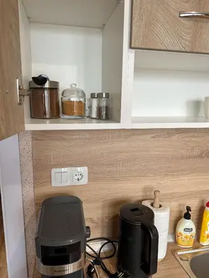 a kitchen counter with a toaster and a coffee maker at One-Bedroom Apartment next to Mall Plovdiv with Free Street Parking in Plovdiv