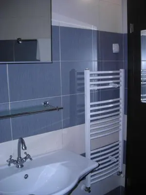 a bathroom with a sink and a mirror at Iglika 2 Top Floor apartment in Borovets