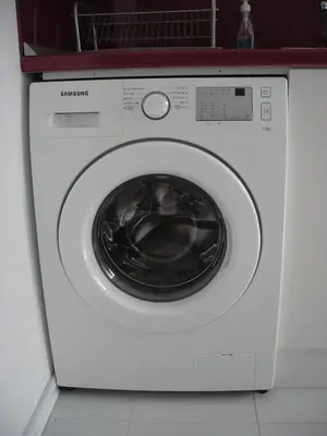 a white washing machine sitting in a kitchen at Iglika 2 Top Floor apartment in Borovets