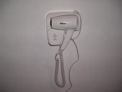 a phone hanging on a wall with a handset at Iglika 2 Top Floor apartment in Borovets