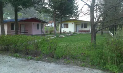 a small house in the middle of a yard at Guest House Rainbow in Cherni Osŭm