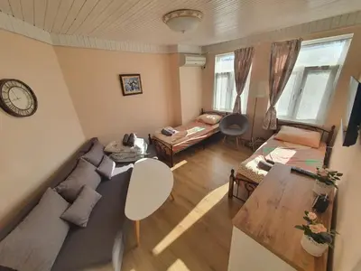 a living room with a couch and a table at Guest House Old City Plovdiv in Plovdiv