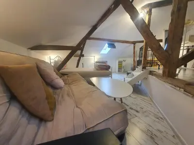 a living room with a couch and a table at Guest House Old City Plovdiv in Plovdiv