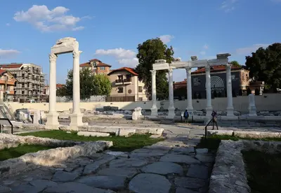 a group of columns and a building with buildings at Portata in Plovdiv