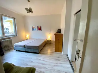 a bedroom with a large bed in a room at Happy Appointment in Sofia