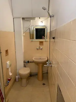 a small bathroom with a toilet and a sink at Happy Appointment in Sofia