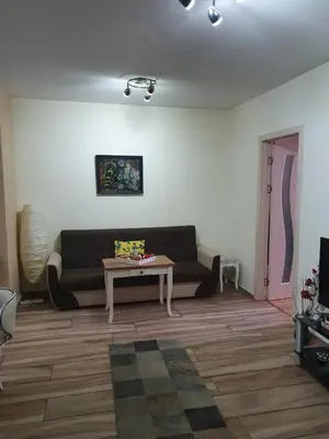 a living room with a couch and a table at Sofia escape in Sofia