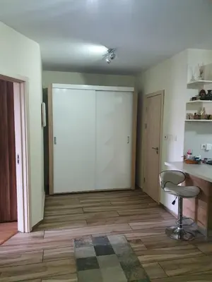 an empty room with a sliding door and a chair at Sofia escape in Sofia