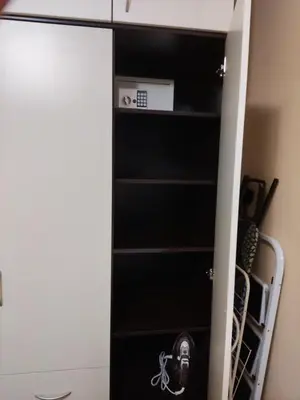 a black book shelf in a room at Апартамент почивка в планината in Pamporovo