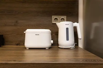 two toasters sitting next to each other on a counter at Downtown apt Atelier 53 - Free Parking in Plovdiv