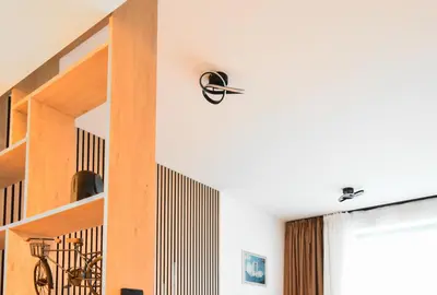 a staircase in a house with wooden shelves at Little Sugar Home in Sofia