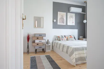 a bedroom with a bed and a vase of flowers at Old Town Bijou in Sofia