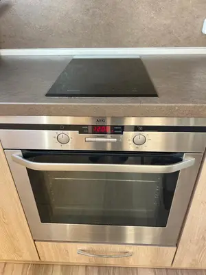 a oven in a kitchen with a counter top at Lima 2BDR cozy Apt near Business Park w Work Desk in Sofia