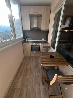 a small kitchen with a table and a window at Lima 2BDR cozy Apt near Business Park w Work Desk in Sofia