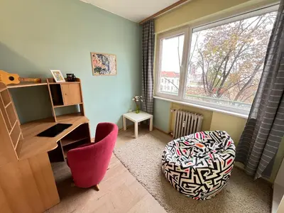 a room with a desk and a chair and a window at Bogota Central Apt w Office Space and Wifi near Metro in Sofia