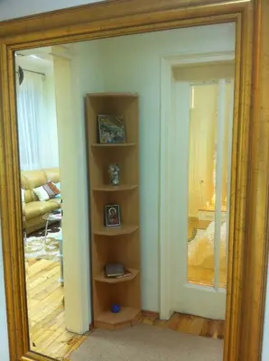 a mirror in a room with a living room at Gogol 2BR Apartment in Sofia