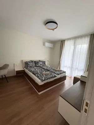 a bedroom with a large bed in a room at New Urban Stay Airport city center metro access in Sofia