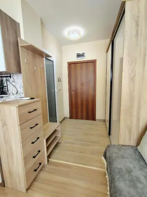a room with a closet with a dresser and a door at Charming Studio 88 in Bansko